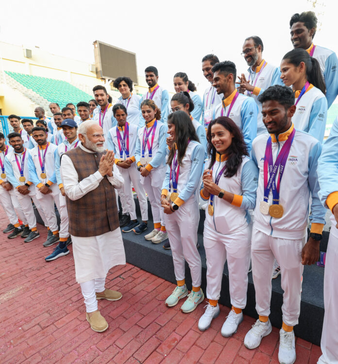 PM Modi interacts with contingent of Indian Athletes